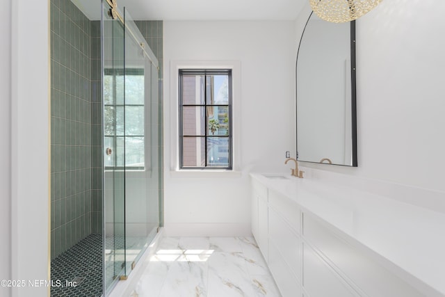 bathroom with baseboards, a shower stall, marble finish floor, and vanity