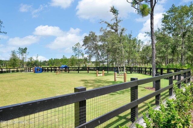 view of property's community featuring fence
