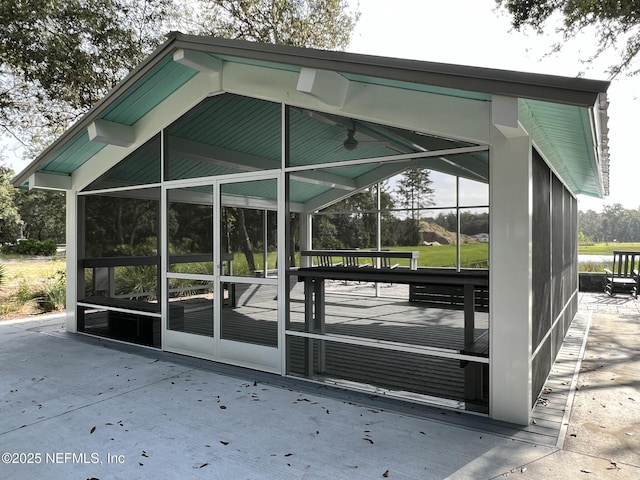 view of outbuilding with a sunroom
