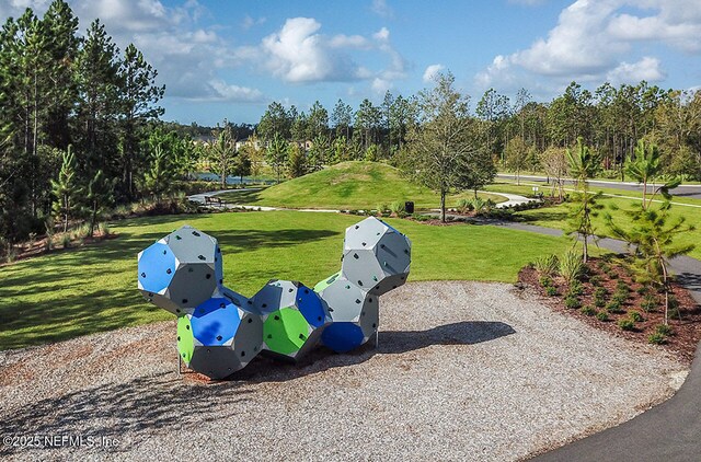 surrounding community with a yard