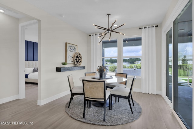208 Curved Bay Trl, Ponte Vedra, FL 32081 - dining space featuring recessed lighting, baseboards, a notable chandelier, and wood finished floors