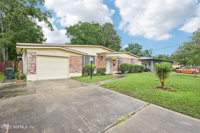 7437 Ortega Hills Dr, Jacksonville, FL 32244 - ranch-style home with brick siding, concrete driveway, and an attached garage
