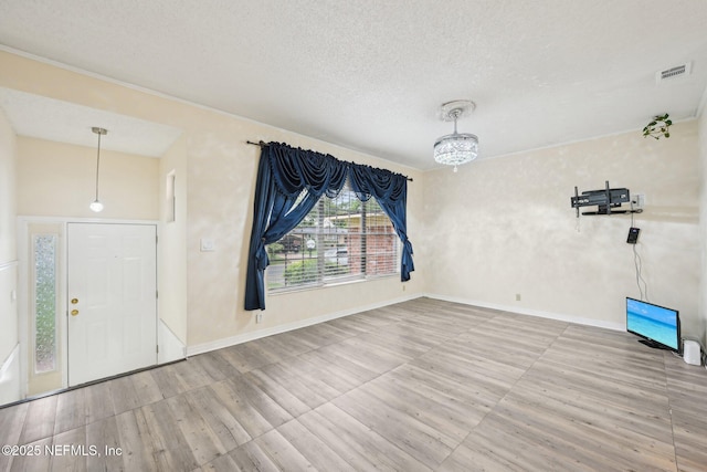 7437 Ortega Hills Dr, Jacksonville, FL 32244 - empty room with wood finished floors, a textured ceiling, and baseboards