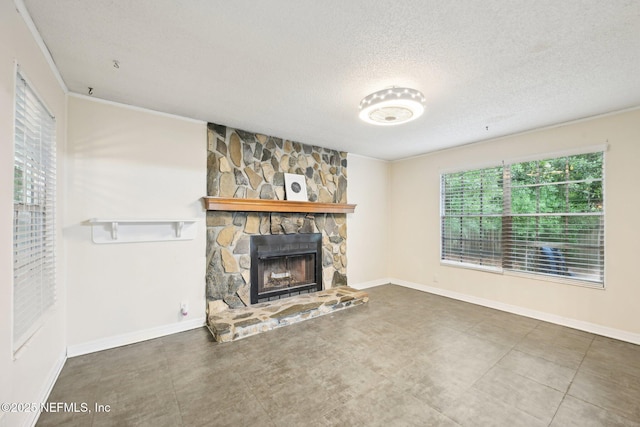 7437 Ortega Hills Dr, Jacksonville, FL 32244 - unfurnished living room featuring a stone fireplace, a textured ceiling, and baseboards