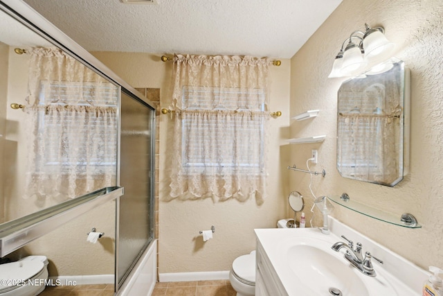 7437 Ortega Hills Dr, Jacksonville, FL 32244 - bathroom with toilet, a textured ceiling, tile patterned flooring, combined bath / shower with glass door, and vanity