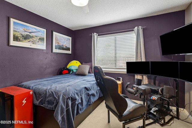 bedroom featuring a textured ceiling and carpet