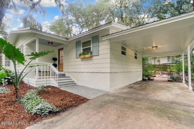view of front of home featuring an attached carport