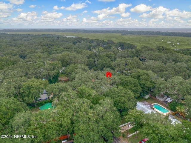 birds eye view of property with a wooded view