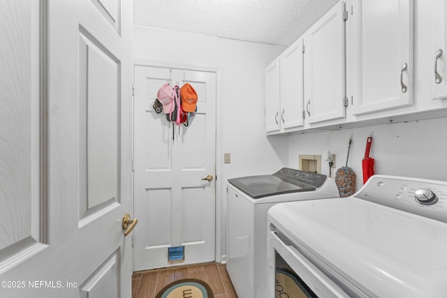 10919 Houndwell Way, Jacksonville, FL 32225 - laundry area featuring a textured ceiling, wood finished floors, cabinet space, and washer and clothes dryer