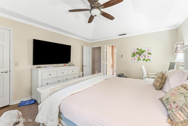 10919 Houndwell Way, Jacksonville, FL 32225 - bedroom featuring a ceiling fan, wood finished floors, vaulted ceiling, visible vents, and ornamental molding
