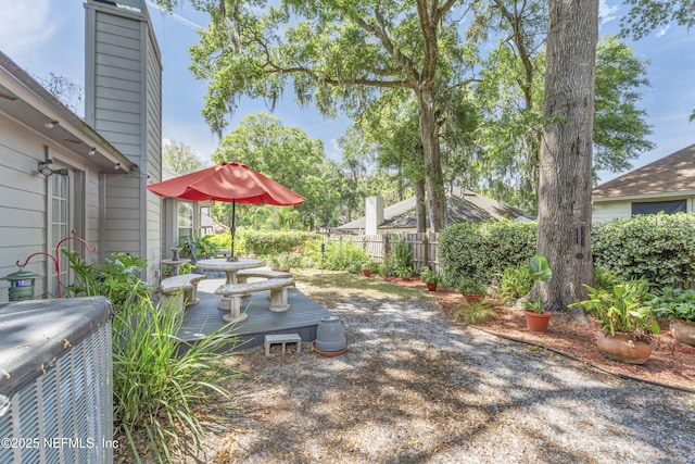 10919 Houndwell Way, Jacksonville, FL 32225 - view of yard featuring fence, central air condition unit, and a wooden deck