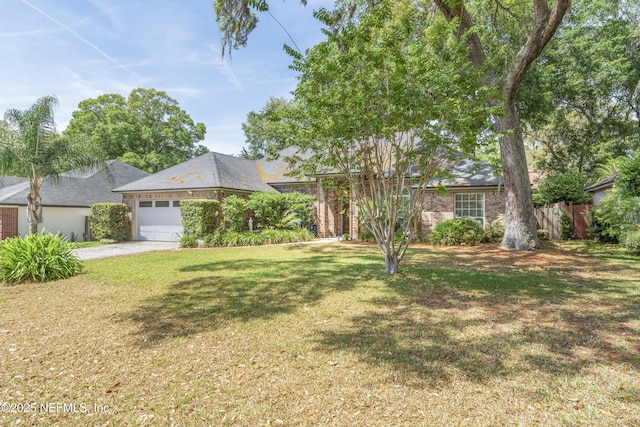 10919 Houndwell Way, Jacksonville, FL 32225 - single story home featuring fence, an attached garage, a front lawn, brick siding, and driveway