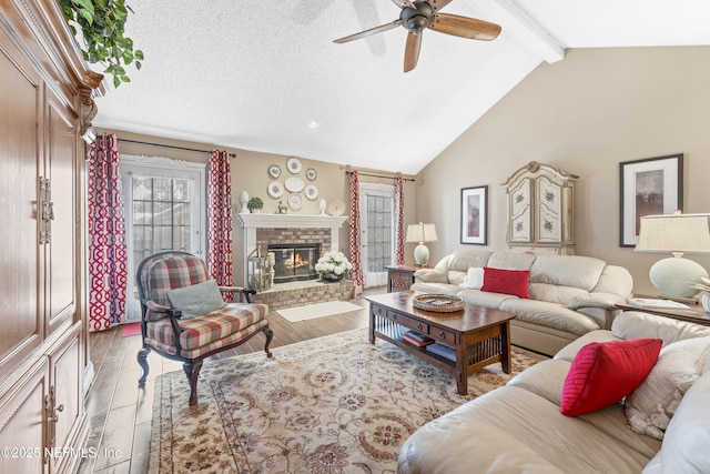 10919 Houndwell Way, Jacksonville, FL 32225 - living area with wood finished floors, beam ceiling, a fireplace, high vaulted ceiling, and a ceiling fan