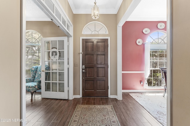 10919 Houndwell Way, Jacksonville, FL 32225 - entrance foyer featuring crown molding, dark wood-style flooring, and baseboards