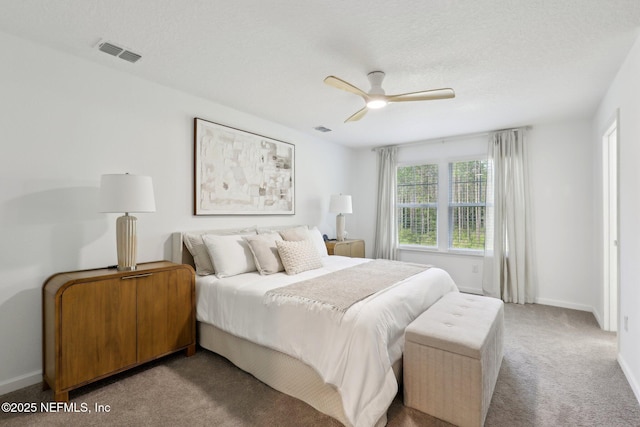 bedroom with visible vents, carpet, ceiling fan, and baseboards