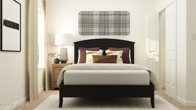 carpeted bedroom featuring baseboards