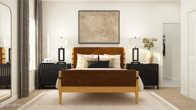 bedroom featuring baseboards and light carpet