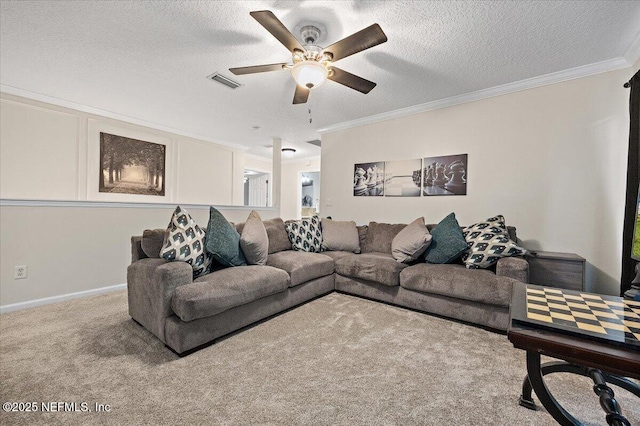 living room with a ceiling fan, a textured ceiling, visible vents, ornamental molding, and carpet