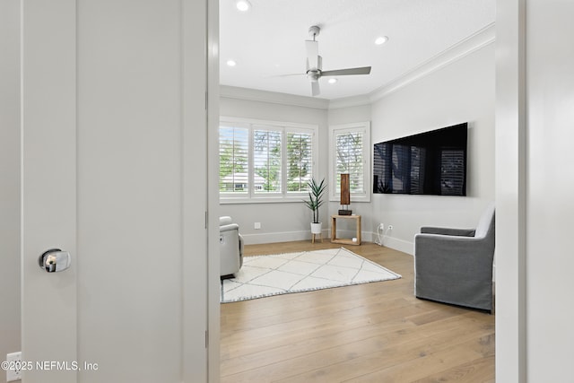 interior space featuring ceiling fan, wood finished floors, baseboards, ornamental molding, and recessed lighting