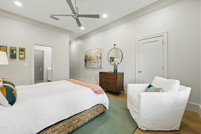 bedroom with crown molding, recessed lighting, visible vents, and wood finished floors