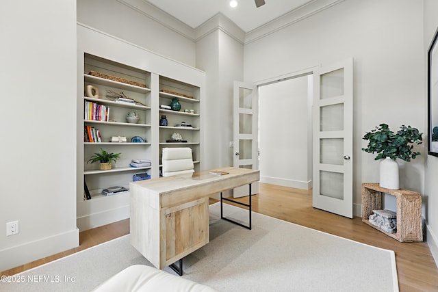 office area featuring french doors, ornamental molding, light wood finished floors, and baseboards