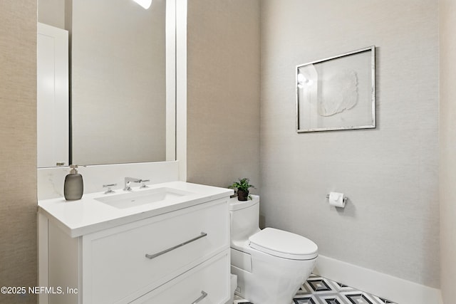 bathroom with vanity and toilet