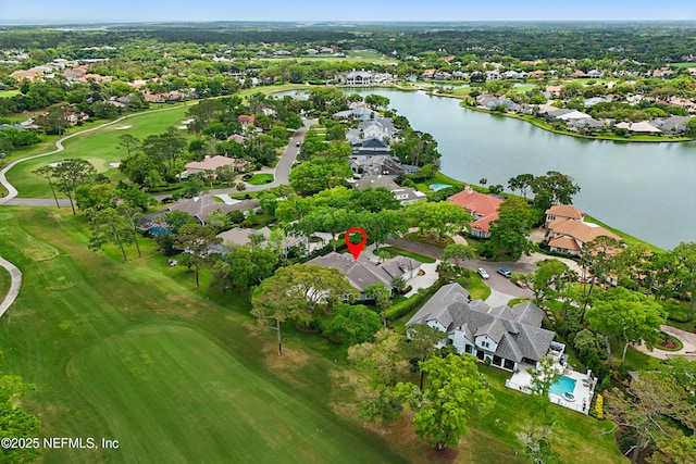 aerial view with a residential view, view of golf course, and a water view