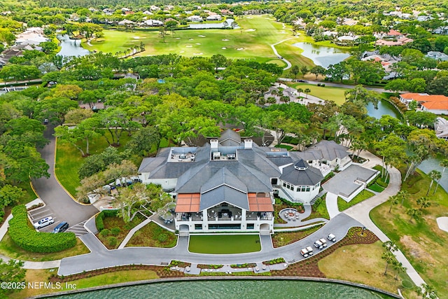 bird's eye view featuring a water view, view of golf course, and a residential view