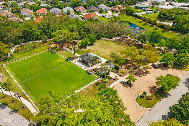 bird's eye view featuring a water view and a residential view