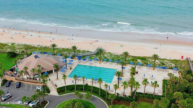 bird's eye view with a water view and a view of the beach