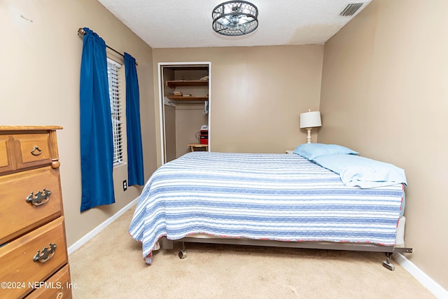 bedroom with baseboards, carpet, and visible vents