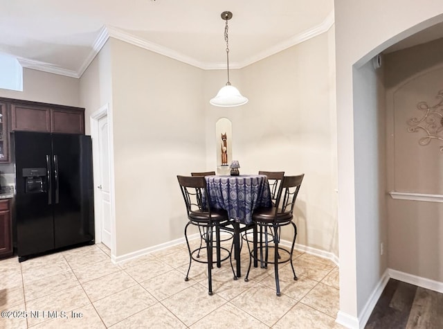 3237 Deer Creek Dr, Middleburg, FL 32068 - dining room featuring arched walkways, ornamental molding, and light tile patterned floors