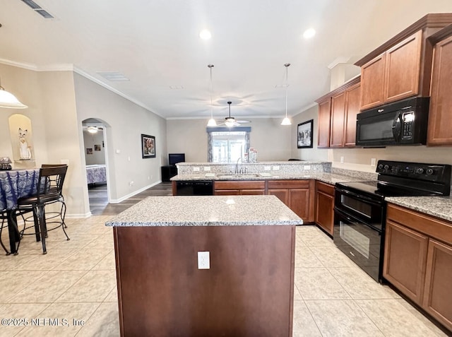 3237 Deer Creek Dr, Middleburg, FL 32068 - kitchen featuring black appliances, arched walkways, ceiling fan, light tile patterned floors, and a peninsula