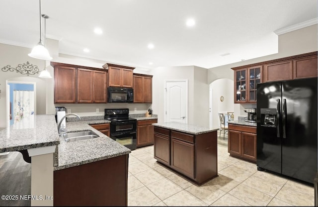 3237 Deer Creek Dr, Middleburg, FL 32068 - kitchen featuring black appliances, arched walkways, a peninsula, ornamental molding, and glass insert cabinets
