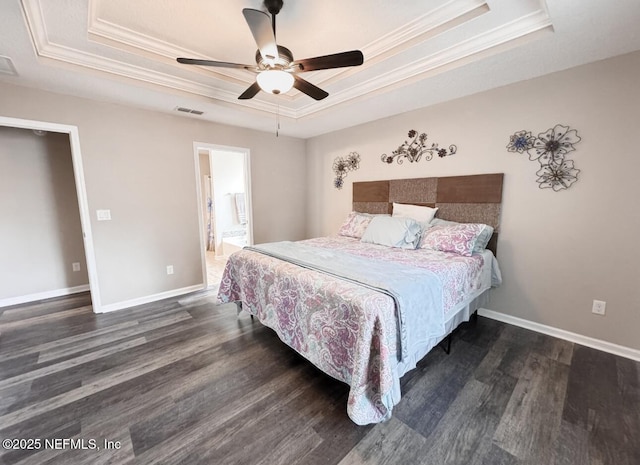 3237 Deer Creek Dr, Middleburg, FL 32068 - bedroom with a tray ceiling, crown molding, wood finished floors, ceiling fan, and connected bathroom