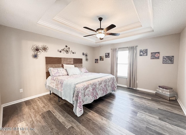 3237 Deer Creek Dr, Middleburg, FL 32068 - bedroom with a raised ceiling, a textured ceiling, wood finished floors, crown molding, and ceiling fan