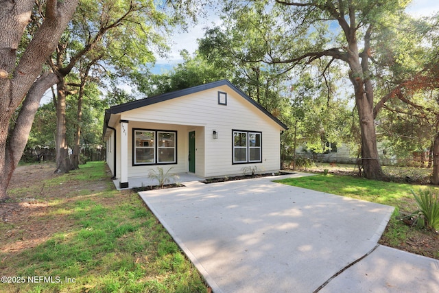 bungalow-style house featuring a porch and fence