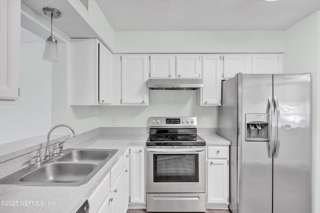 kitchen featuring a sink, light countertops, under cabinet range hood, stainless steel appliances, and white cabinetry