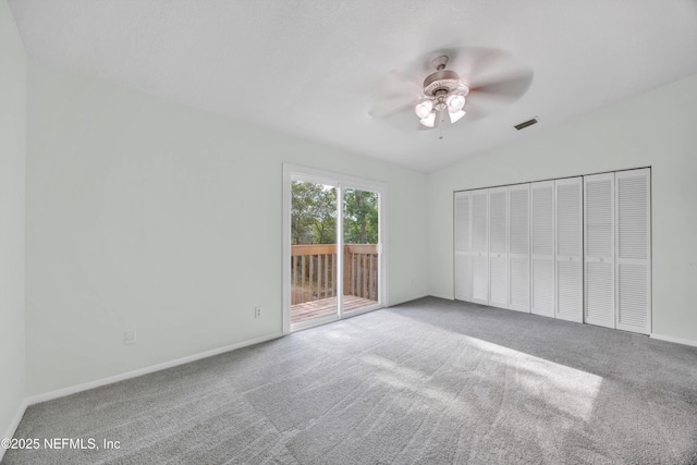 unfurnished bedroom with baseboards, visible vents, carpet, and access to exterior