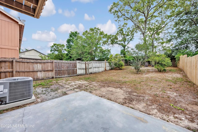 view of yard with a patio, cooling unit, and a fenced backyard
