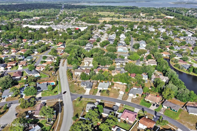 bird's eye view with a water view and a residential view
