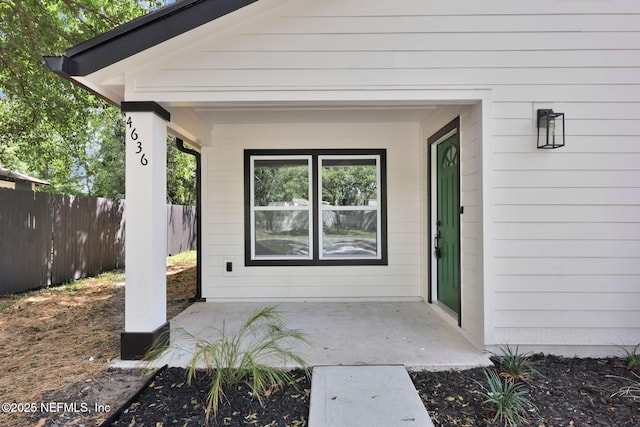 property entrance with fence