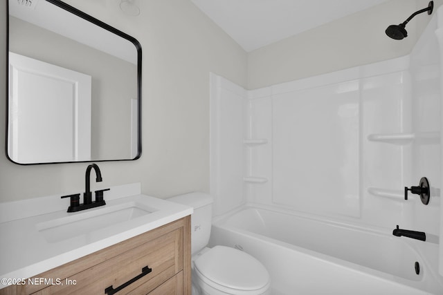full bathroom featuring vanity, toilet, and  shower combination