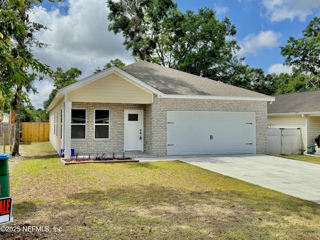 view of front of house featuring fence, an attached garage, brick siding, a front yard, and concrete driveway