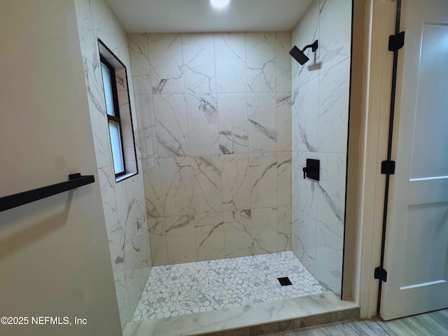 2103 W 14th St, Jacksonville, FL 32209 - bathroom with a marble finish shower and wood finished floors