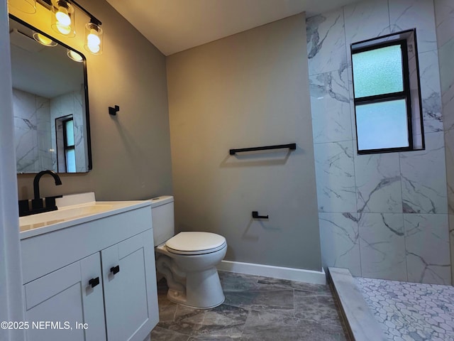 2103 W 14th St, Jacksonville, FL 32209 - bathroom with marble look tiles, vanity, toilet, and a marble finish shower