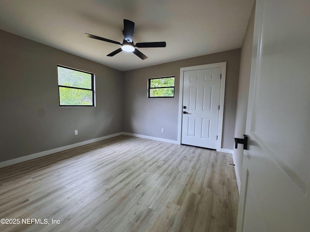 2103 W 14th St, Jacksonville, FL 32209 - spare room with a ceiling fan, light wood-style flooring, and baseboards