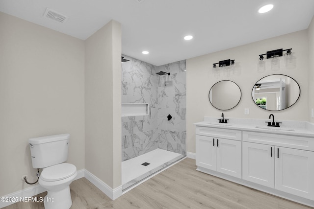 full bath featuring a sink, recessed lighting, toilet, and visible vents