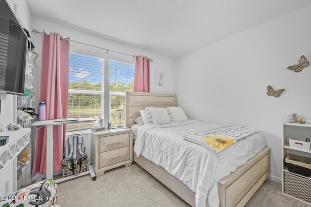 bedroom with light colored carpet
