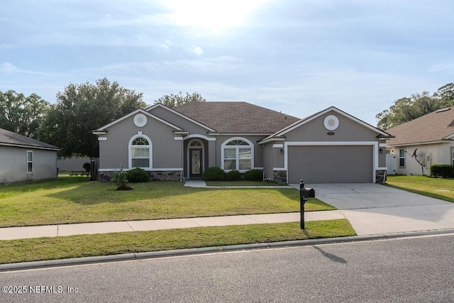 view of front of property with concrete driveway, a front yard, stone siding, and a garage